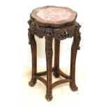 Chinese fruitwood jardinierie stand with inset marble top raised on heavily carved supports with