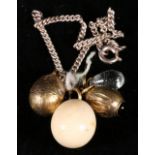 Two early 20th century miniature Russian gold eggs set mixed gem stones also an ivory egg and
