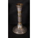 A large candle holder in brass inlaid with copper and silver metal depicting calligraphy and
