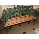 Victorian "Coalbrookdale" green painted cast iron and mahogany garden bench, 90cm tall 144cm wide