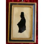 A silhouette of a gentleman on glass with a tall hat,
