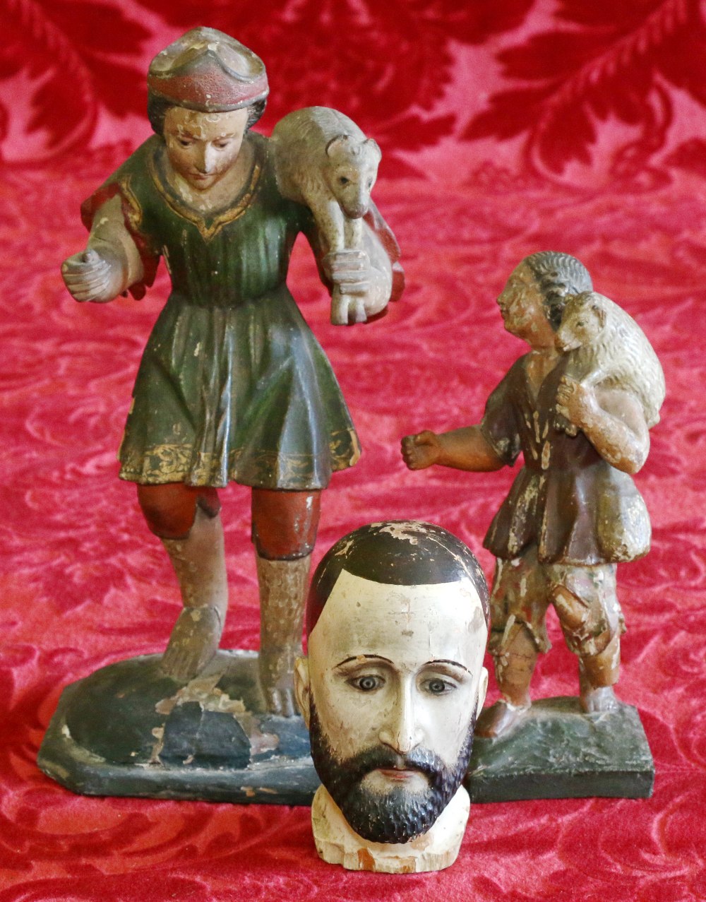 Italian painted pine head of a bearded man, 14cm, together with two painted gesso nativity figures,