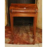 Mahogany side table with scroll front frieze drawer raised on reeded supports,