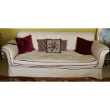 Victorian mahogany cream upholstered sofa with turned legs and brass castors CONDITION REPORT: The