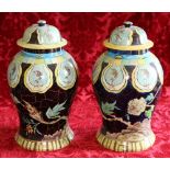 Pair of 20th century painted terracotta baluster jars and domed covers,