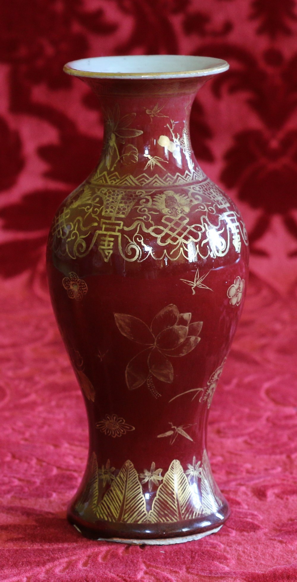 18th century Chinese gilt decorated sang de boeuf vase with floral decorations, bored for