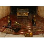 Group of brass fire related items including a footman, set of three fire irons,