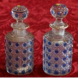 Pair of gilt and blue coloured pressed glass perfume bottles,