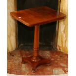 Mid 19th century flame mahogany side table on a turned and carved column raised on quatrapartite