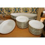 Set of Richard Ginori 'Spoleto Festival' dishes in white with a gilt band comprising four long oval