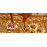 WITHDRAWN 

Two silk velvet carpets of narrow seamed design with floral cartouches on a gold ground,