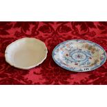 19th century tin glazed Continental dish with floral decoration, 24cm, and another oval dish,
