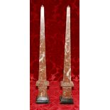 Pair of early 20th century Italian mottled red marble obelisks on black plinth bases, 70cm.