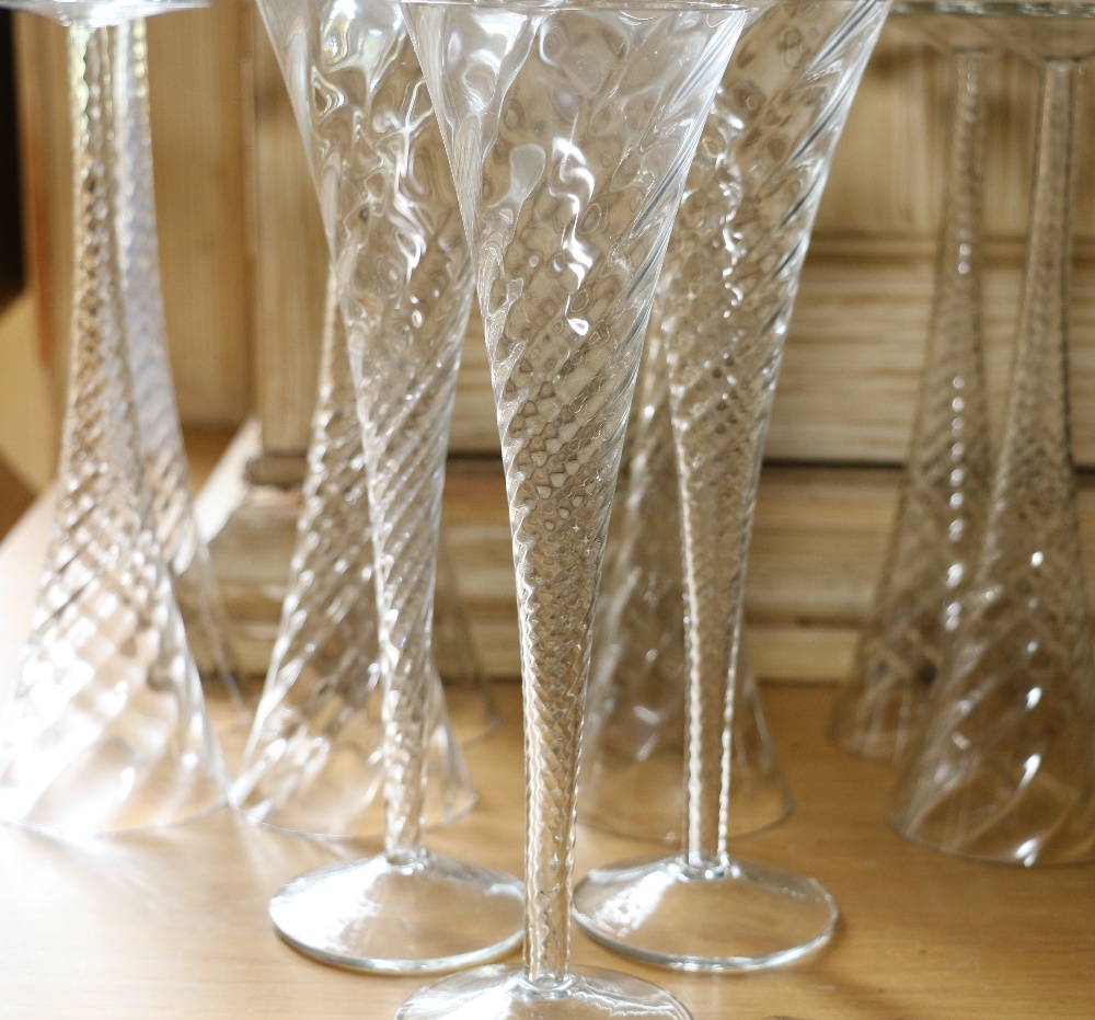 Set of eleven spiral champagne flutes CONDITION REPORT: Two with minor chip to rim