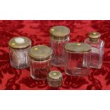 Six silver topped dressing table jars