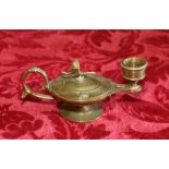 Gilded brass candlestick with scroll handle, the Roman lamp body with dragonfly knop to the lid,