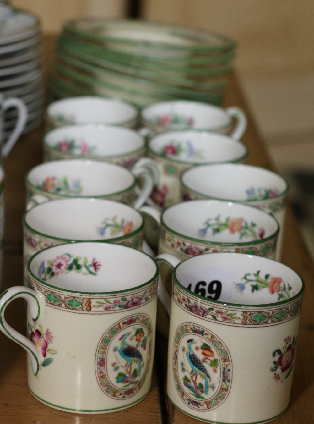 Wedgwood part coffee set with bird and floral decoration comprising ten coffee cans and eleven