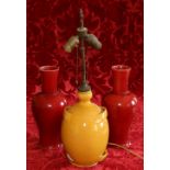 Pair of Italian Bassanello red glazed vases and a French Vallaris yellow glazed vase as a lamp base