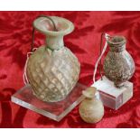 Three Ancient Roman glass bottles,