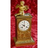 Early 19th century ormulu mounted clock surmounted by a cherub, over an enamel dial,