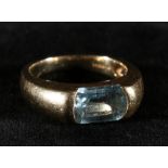 14ct gold gents ring set with pale blue baguette stone,