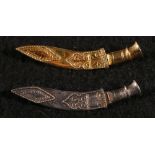 Unhallmarked high carat gold kukri brooch and another in silver (2), 7 grams and 3.