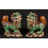 Pair of Chinese 19th century Sancai glazed lion dogs on shaped bases