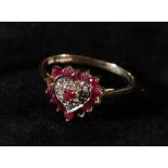 9ct gold ruby and diamond ring, the stones set in heart form,