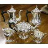 Silver five piece tea set of baluster form comprising a teapot, hot water, coffee pot,