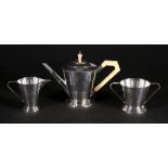 EP three piece teaset of Art Deco stepped inverted tapering shape and another of moulded boat shape.