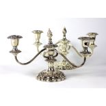 A pair of silver plated candelabra, each