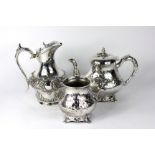 A Victorian silver plated tea pot and tw