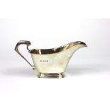A silver cream jug William Neale & Son L