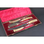 A five piece carving set, each with antl