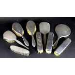 A set of five silver backed brushes a ha