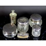 A collection of silver topped glass jars