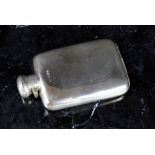 A George V silver hip flask and hinged c