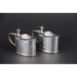 A pair of silver mustards, with horn shaped thumb pieces, Stokes & Ireland Ltd, London, 1903, 7cm