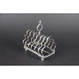 A George III silver six division toast rack Richard Crossley London 1804, of canted rectangular