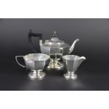 An Art Deco three piece silver bachelors tea set, with ebony finial and handle, A L Davenport Ltd,
