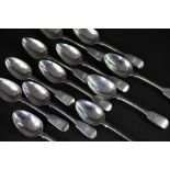 A collection of twelve fiddle pattern dessert spoons, London 1828-1862, makers include; William