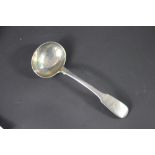 A George IV silver fiddle pattern sauce ladle, John Harris V, London 1833, engraved crest to the