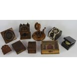 A collection of 19th century treen pocket watch stands and cases, comprising a Black Forest stand