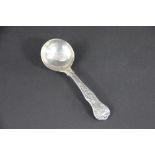 A silver Queens pattern sugar spoon, London 1830 makers mark 'JJC', inscribed to the back of the