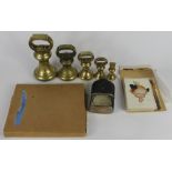 A graduated set of four Victorian brass weights, 7lb, 4lb, 2lb and 1lb, with an 8oz weight and