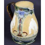 A Doulton Lambeth stoneware cricket jug circa 1900, the three panels depicting a bowler,