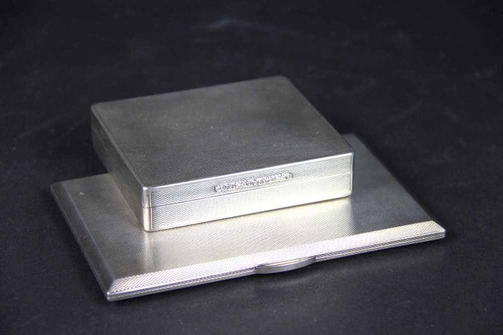 An engine turned silver cigarette case, A Nicholls & Son, Birmingham 1953, 13.