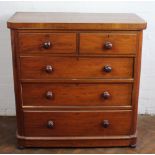 A Victorian mahogany chest, of two short and three long drawers on plinth base,