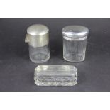 Three silver topped and glass dressing table jars, to include; A plain example,