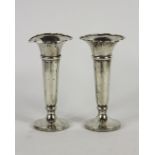 A pair of silver posy vases, Walker and Hall, Sheffield 1913, each of plain polished,